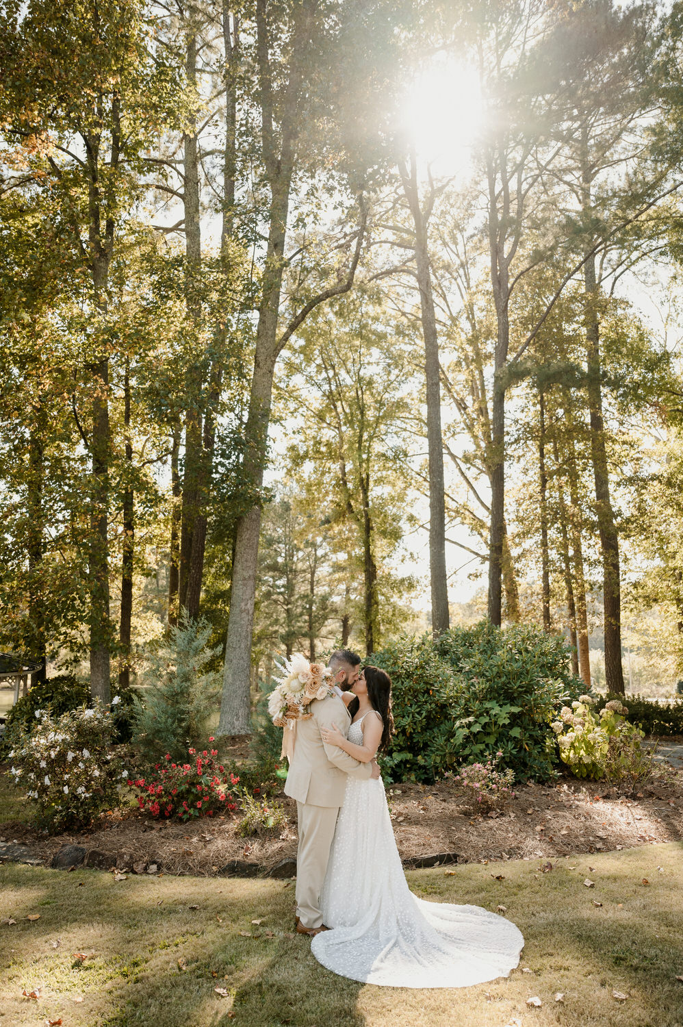 bride and groom kissing at little river farms a georgia wedding venue
